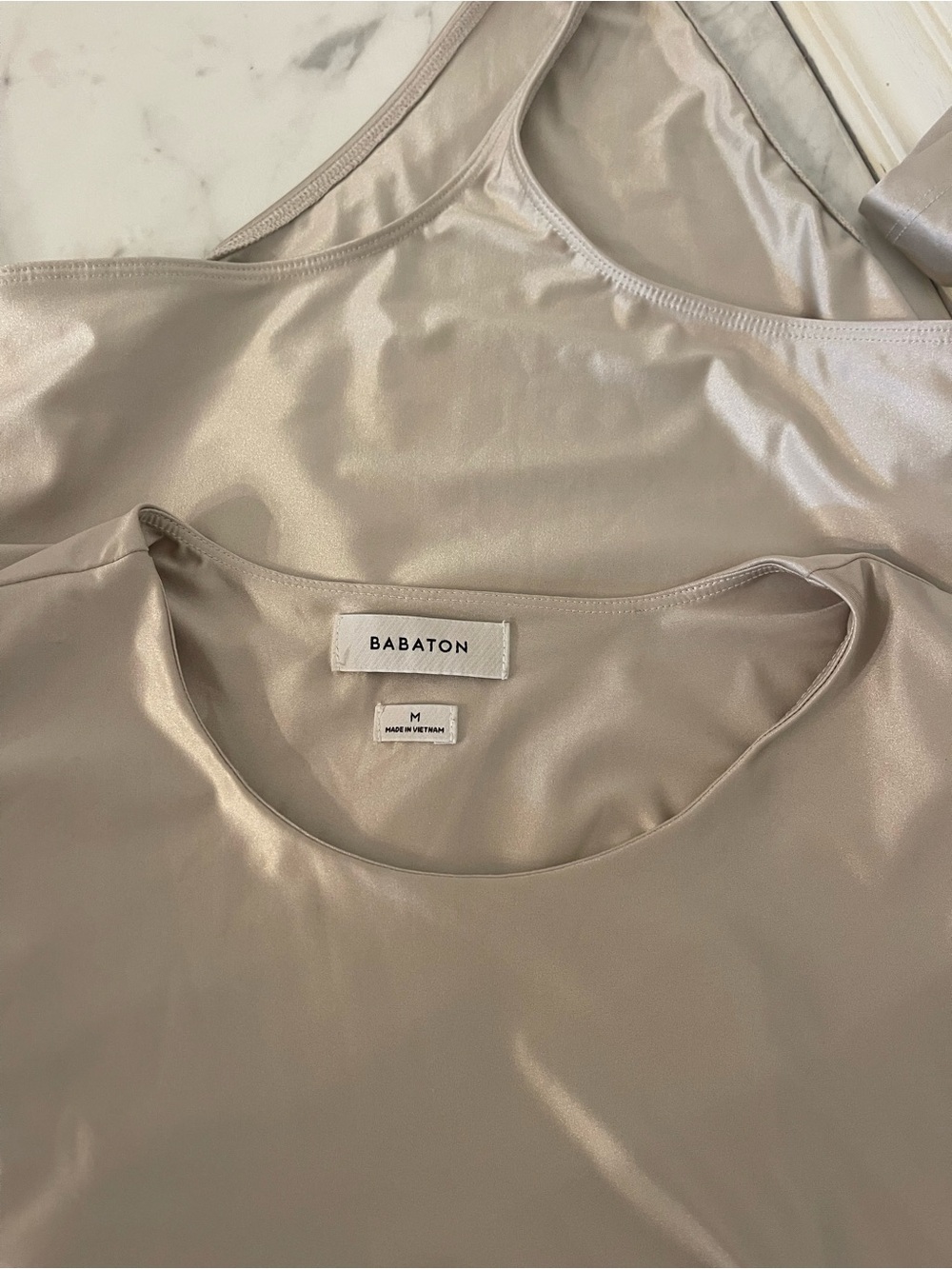 Babaton Long-Sleeve Satin-Look Bodysuit in Shimmery Neutral
